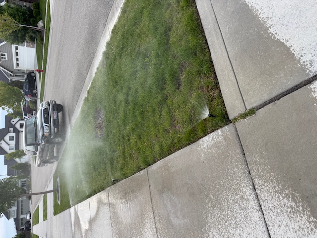 fixed spray sprinklers watering front berm