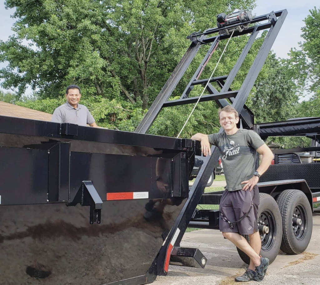 clayton roll outside a new dumpster 